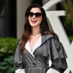 Anne Hathaway con vestido blanco mostrando su embarazo en video emotivo de Instagram